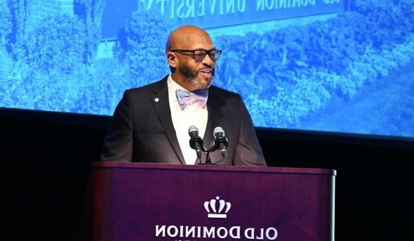 A man stands at a podium.