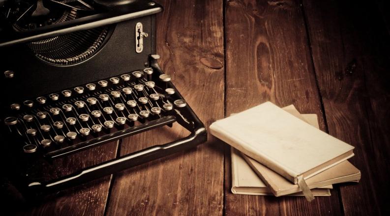 Photo of a typewriter on a desk.