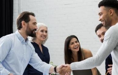 Two male executives shaking hands