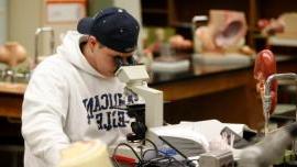 Student Using Microscope